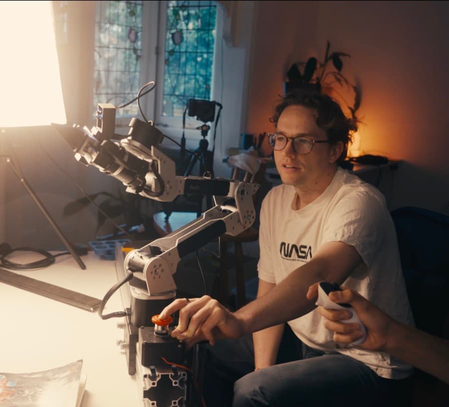 Ed teleoperating a robot arm
